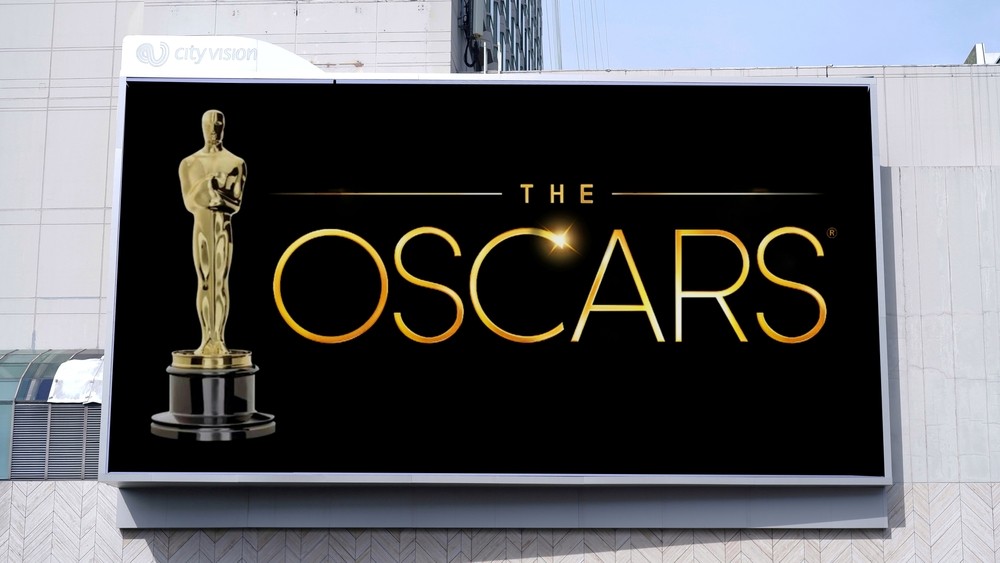 The words "Oscars"on a black LED billboard